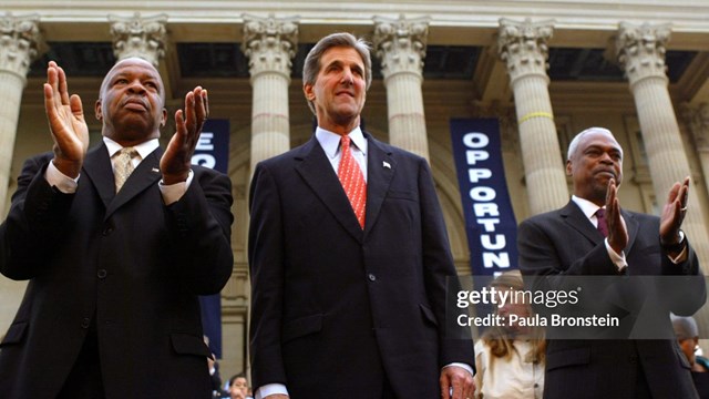 Elijah Cummings, John Kerry, and Wade Henderson stand on the Topeka Capitol steps