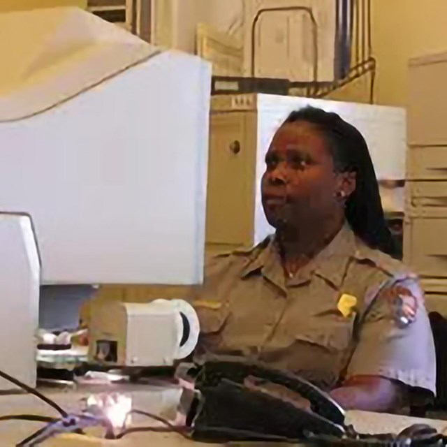A ranger uses a microfiche machine