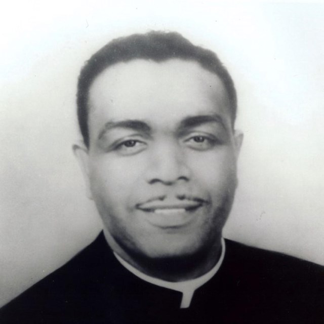 Head and shoulders portrait of Oliver Brown in his pulpit robes.