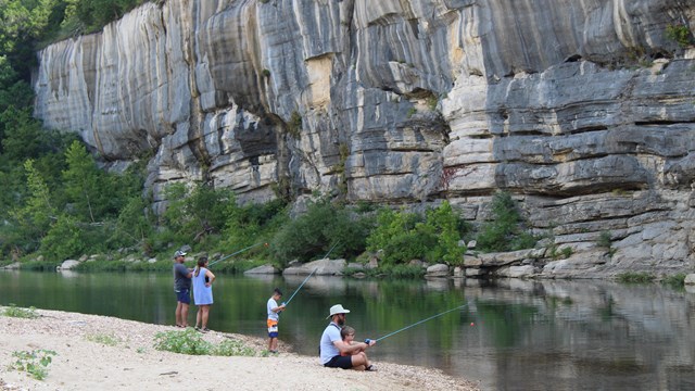 Families fishing in front of Painted Bluff.