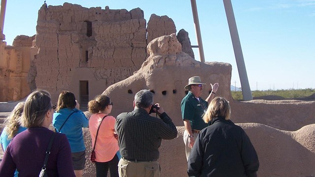 volunteer leading tour of ruins