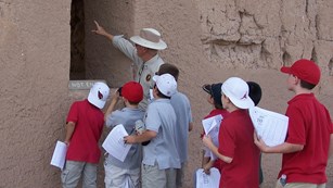 volunteer ranger leading group of children on tour