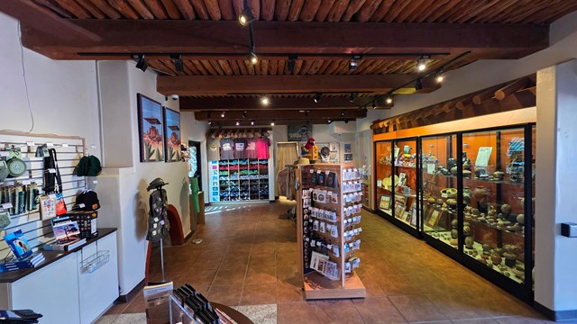 A view inside the bookstore with souvenirs, t-shirts, hats, and more products