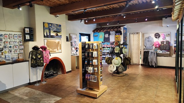 A view inside the bookstore with souvenirs, t-shirts, hats, and more products