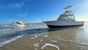 two vessels grounded on the beach