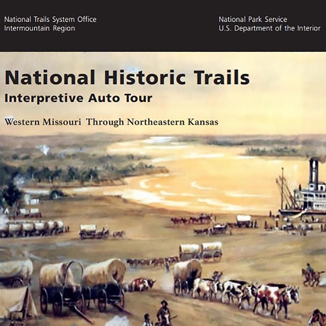 The cover of an auto tour route guide, depicting a scene of emgirants travelings towards the river.