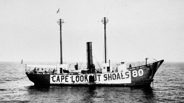 Black and white Cape Lookout Shoals Lightship in the water 