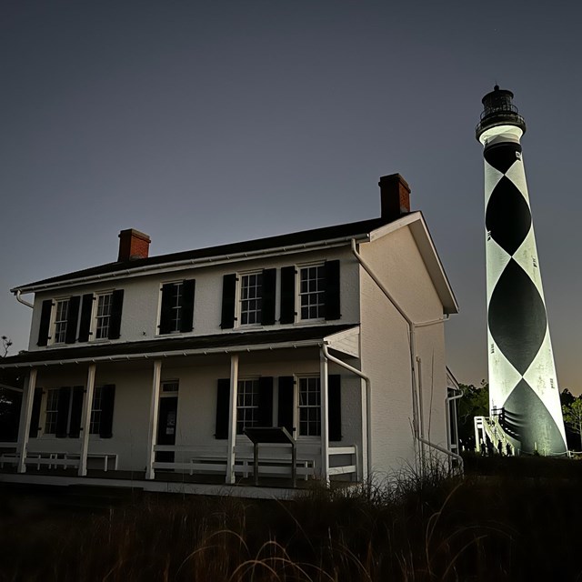 The Lighthouse and Keeper Quarters at dusk. View point is from the ground looking up. 