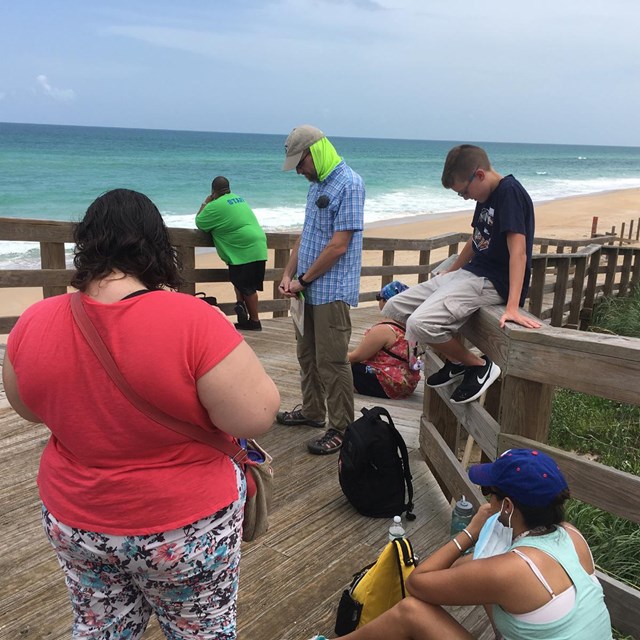 Students listen to the sounds of the seashore.