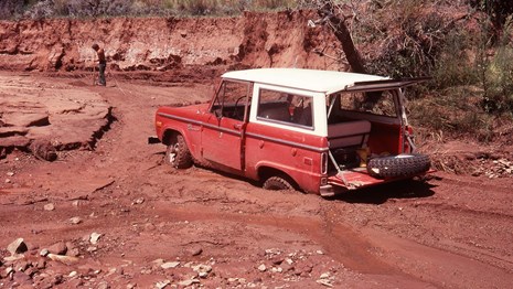 A boater rowing a dory on the river