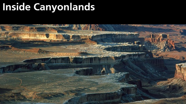 photo of scalloped, shadowy canyon edges beneath black box "Inside Canyonlands" with NPS arrowhead