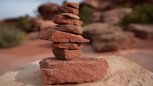 Stacked rocks form a cairn along the trail in Canyonlands National Park.