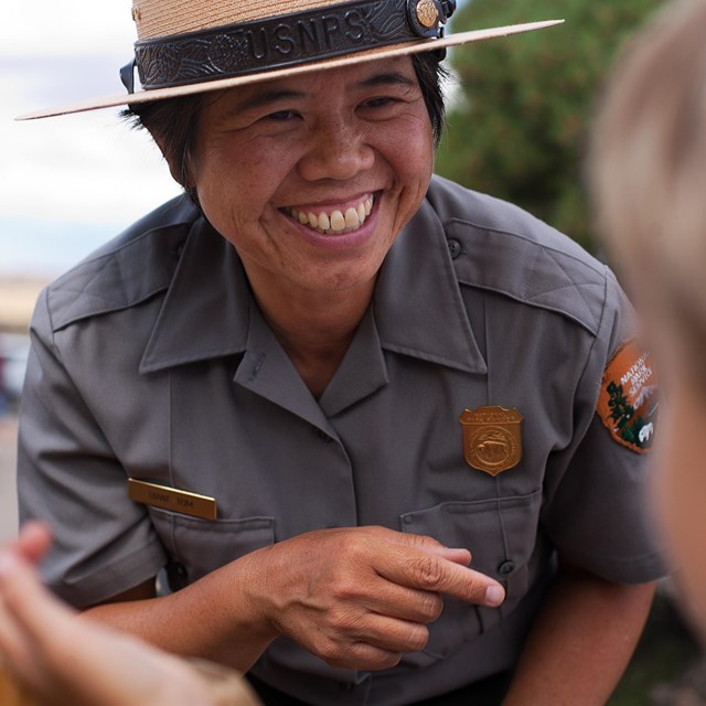 A Ranger talks to a Junior Ranger