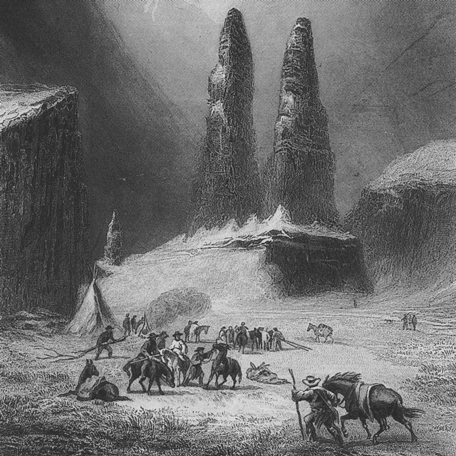 Black and white engraving of men, animals, and two large rock pillars.