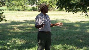 Ranger standing in grassy field