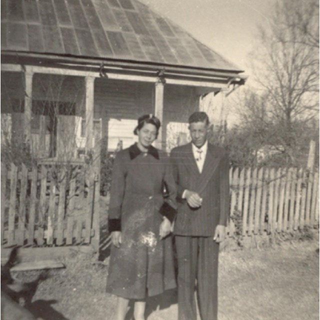 Camille and Leo Metoyer stand in front of Oakland Plantation Overseer's House.