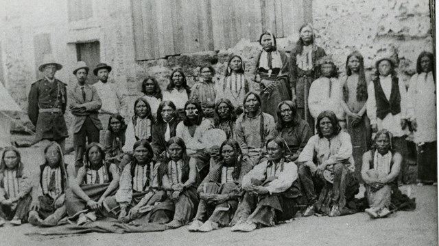 Group of Native Americans posing for a Camera in the Fort's coutyard