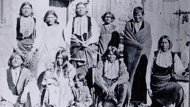 Group of Comanche posing for a photographer 