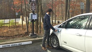 An electric car is plugged in and charging.
