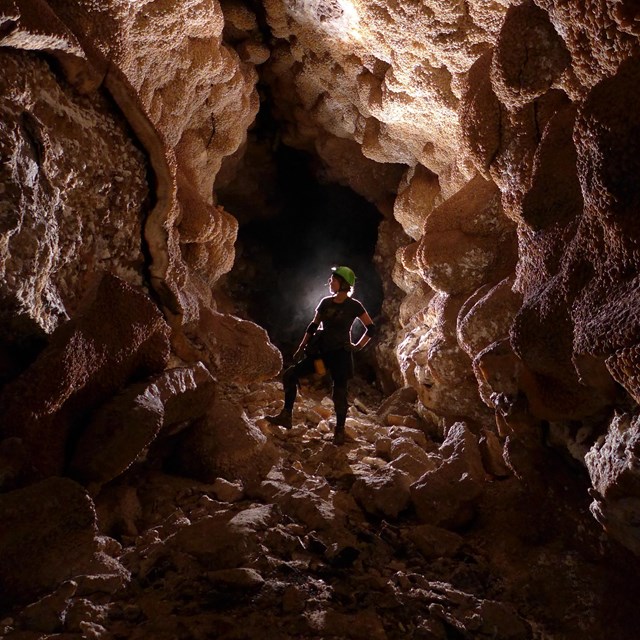 person in a cave