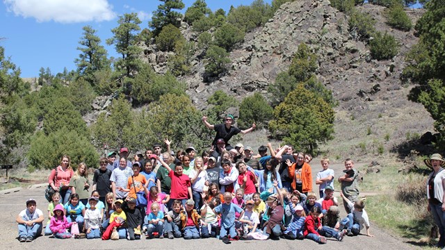 A class of students poses for a group picture.