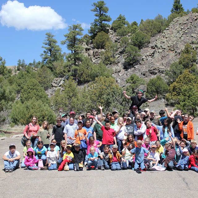 A class of students poses for a group picture.