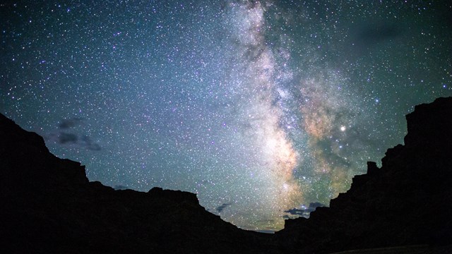 The milky way stretches across the sky above Cataract Canyon.