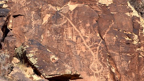 Petroglyphs on red rock
