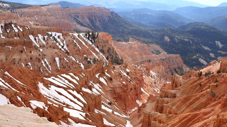 A small amount of snow on the red rocks of the park's geologic amphitheater. 