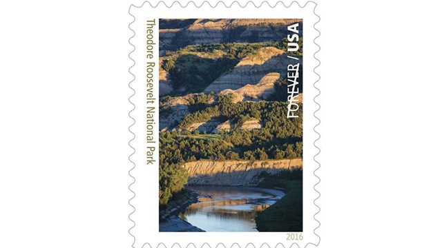 Stamp depicting river and badlands 