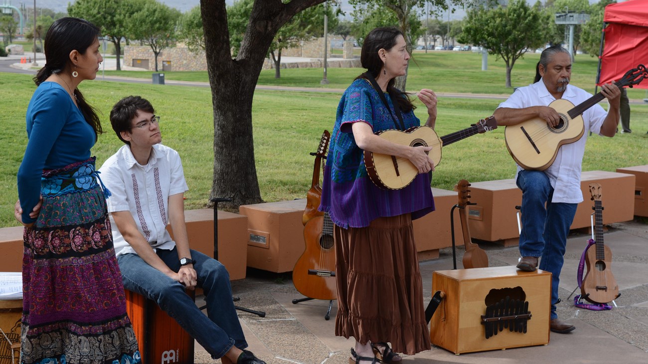 Two musicians play the guitar