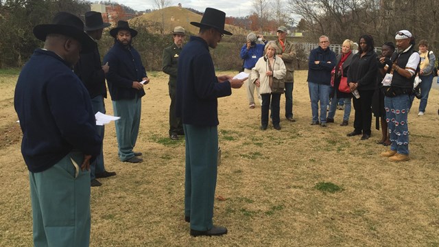 African American living historians addressing a crowd