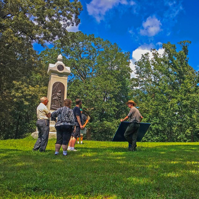 Ranger taking to visitors during a tour