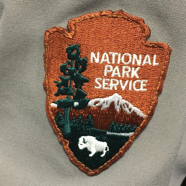 An arrowhead patch on an NPS uniform