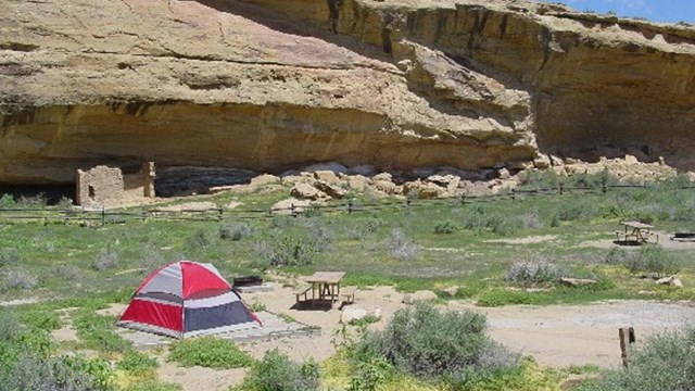A tent in the Gallo Campground in front of a canyon wall.