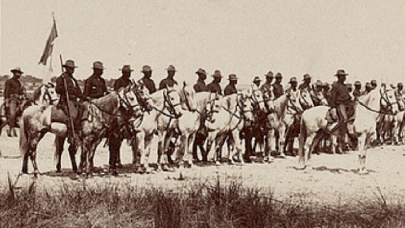 Mounted Buffalo Soldiers (10th Cavalry, Troop M) charging. 