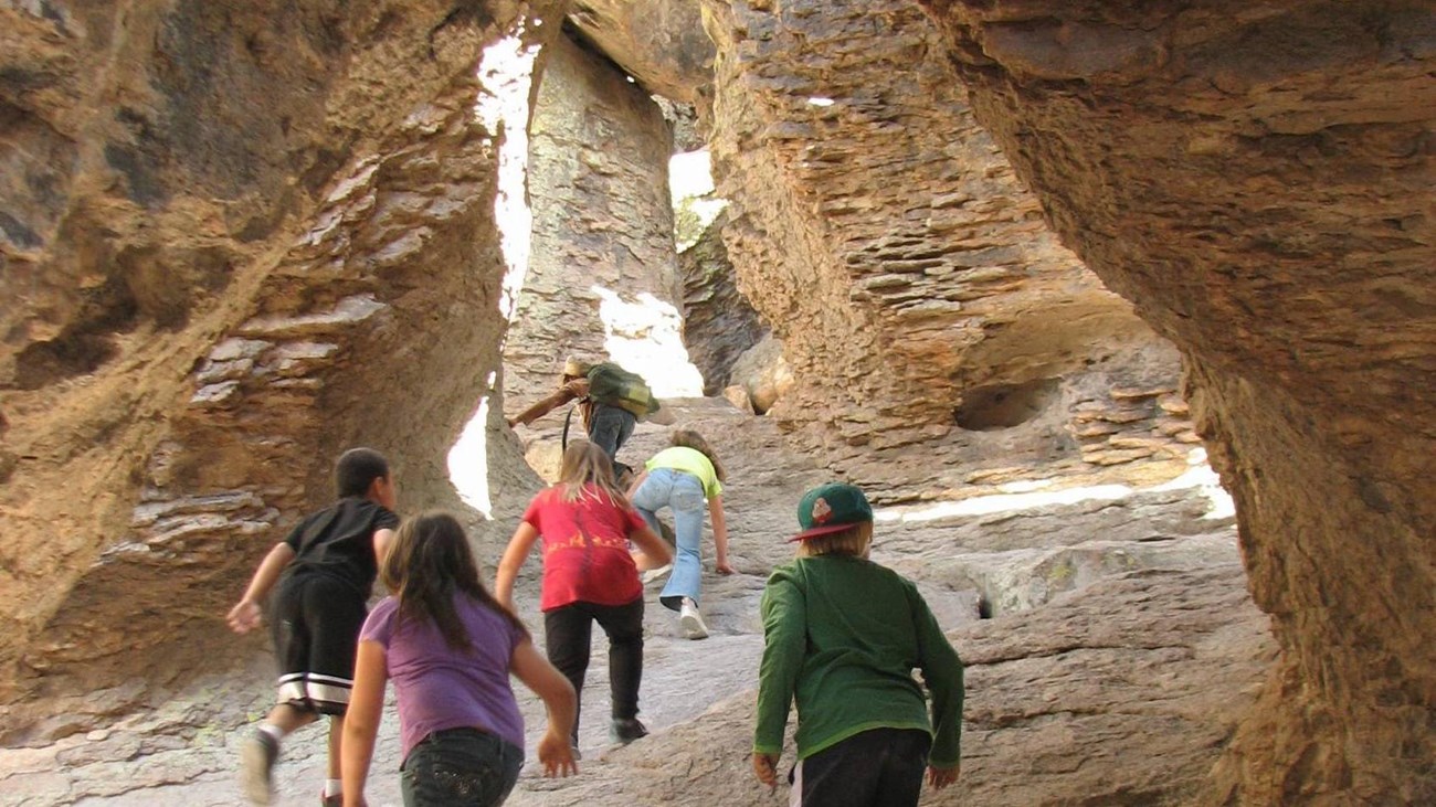 Kids play in a rock grotto