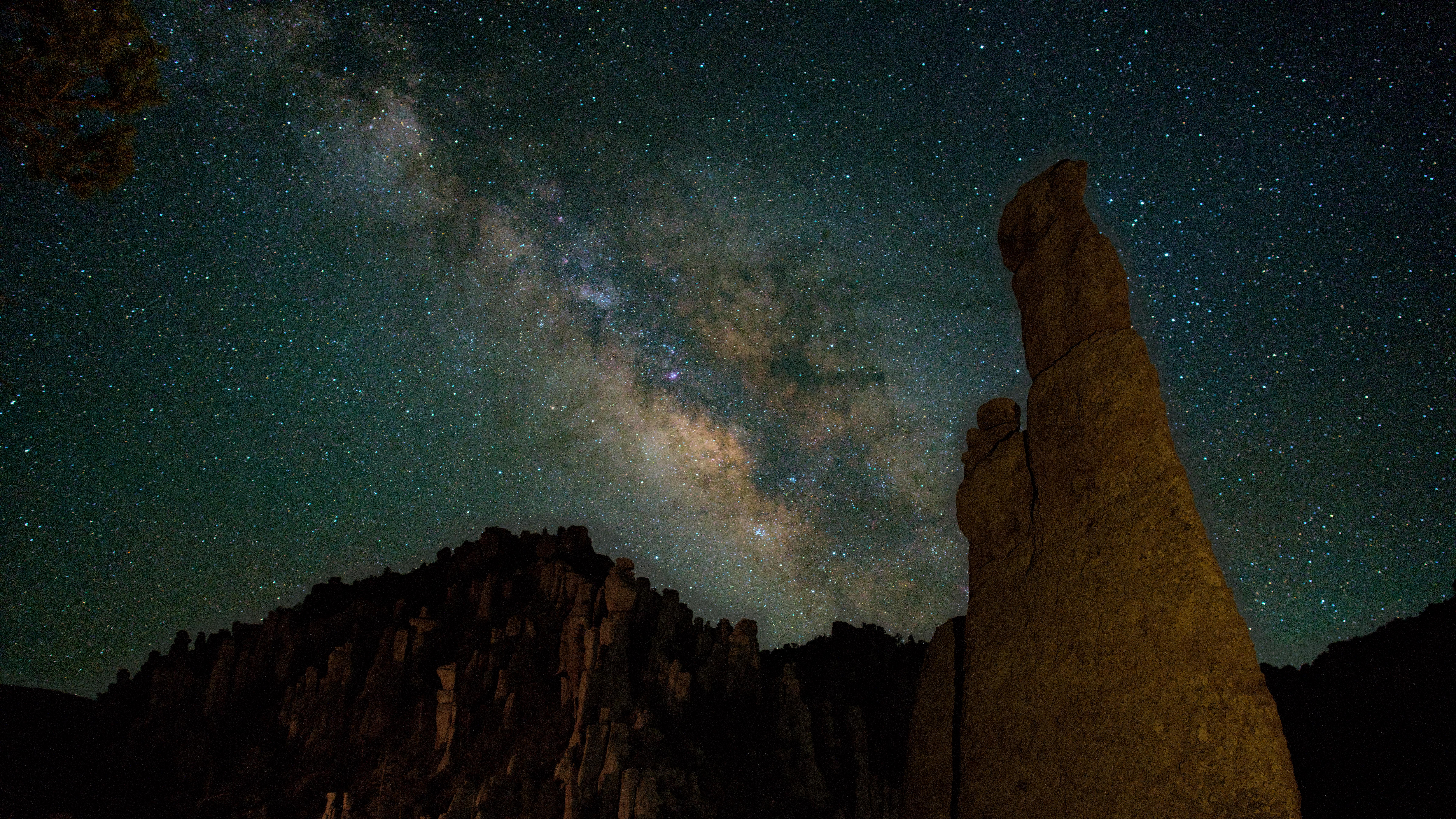 rocks faintly show with bright milky way behind