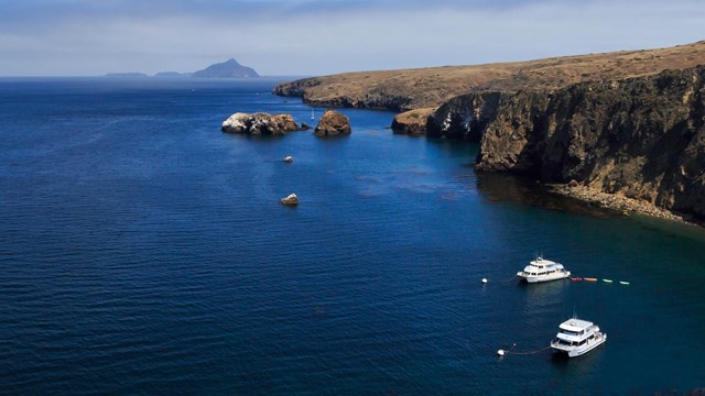 Boats anchored in harbor. ©Tim Hauf, timhaufphotography.com