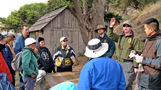 Ranger talking to visitors. 