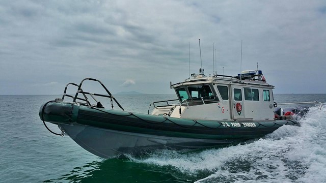 Ranger patrol boat going at high speed. 