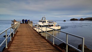 Passengers offloading boat at dock. ©Tim Hauf, timhaufphotography.com