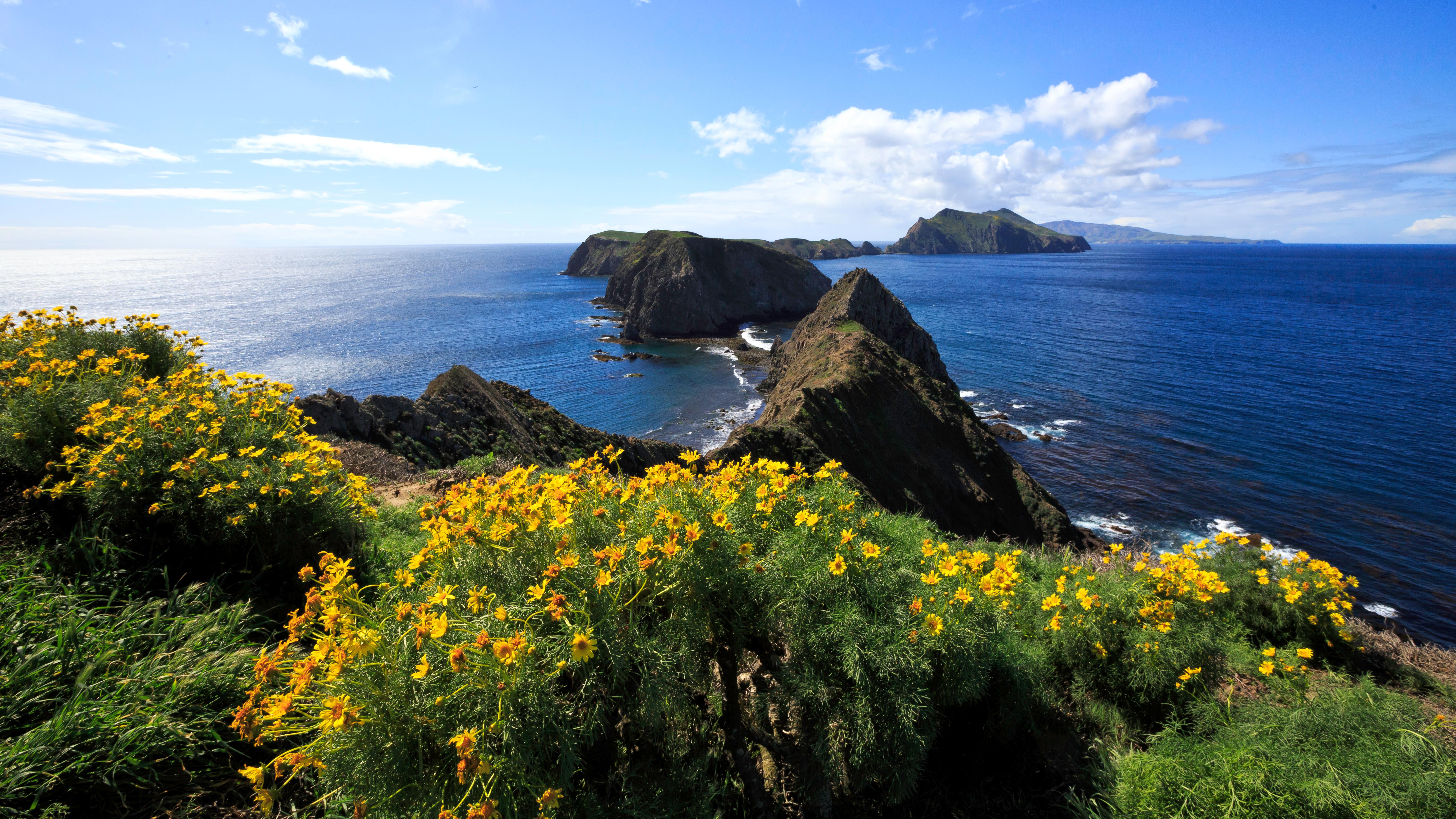 Three islets surrounded by blew water. &copy;Tim Hauf, timhaufphotography.com