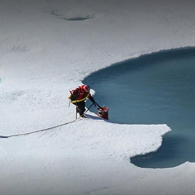 researchers on ice flow