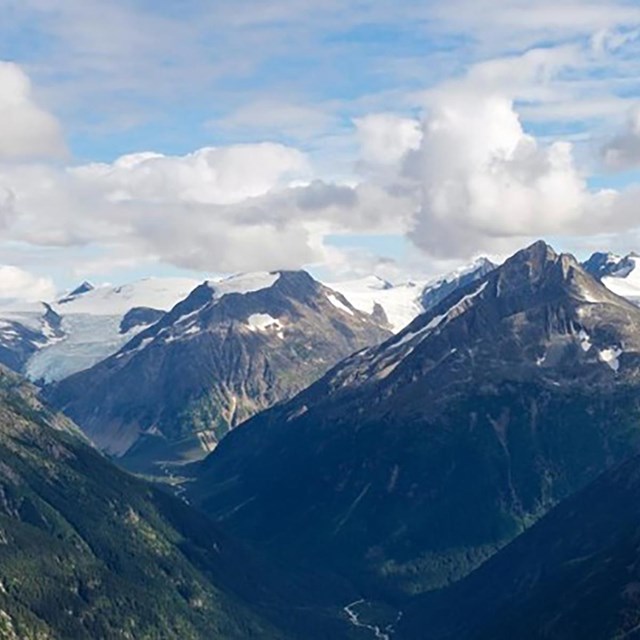 mountains with snow and clouds