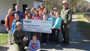 Rangers and partners present check