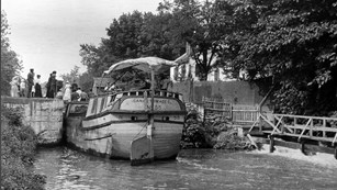 Historic canal photo of a canal boat passing through Lock 20