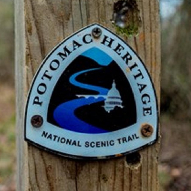 Potomac Heritage Trail marker next to a raised trail