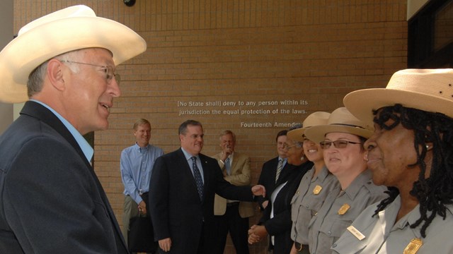 Former DOI Secretary Ken Salazar greets Superintendent Robin White at the site's visitor center.