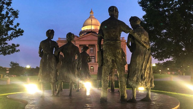 The Testament statues of the Little Rock Nine at sunset